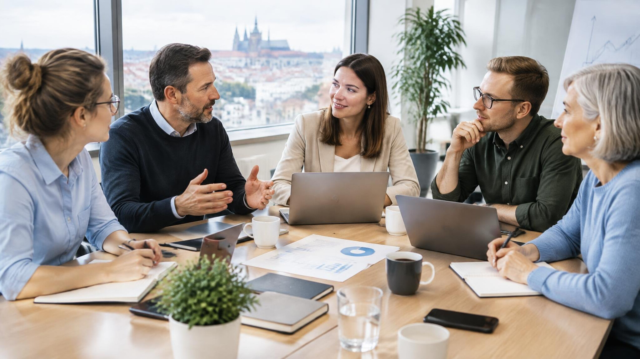 Team of colleagues discussing strategy around a conference table