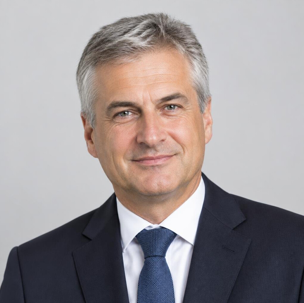 Studio portrait of a senior Slovenian man in business attire
